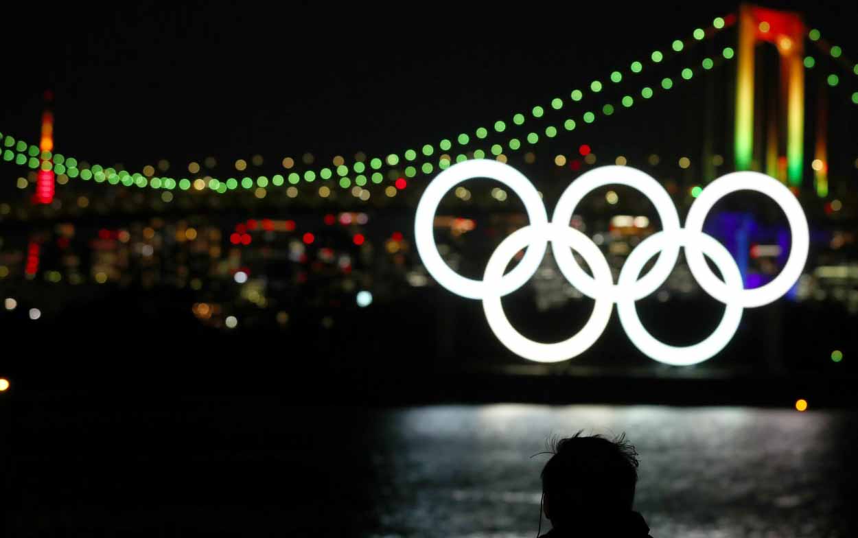 Olympic Symbol and fireworks light up Tokyo six months before Games